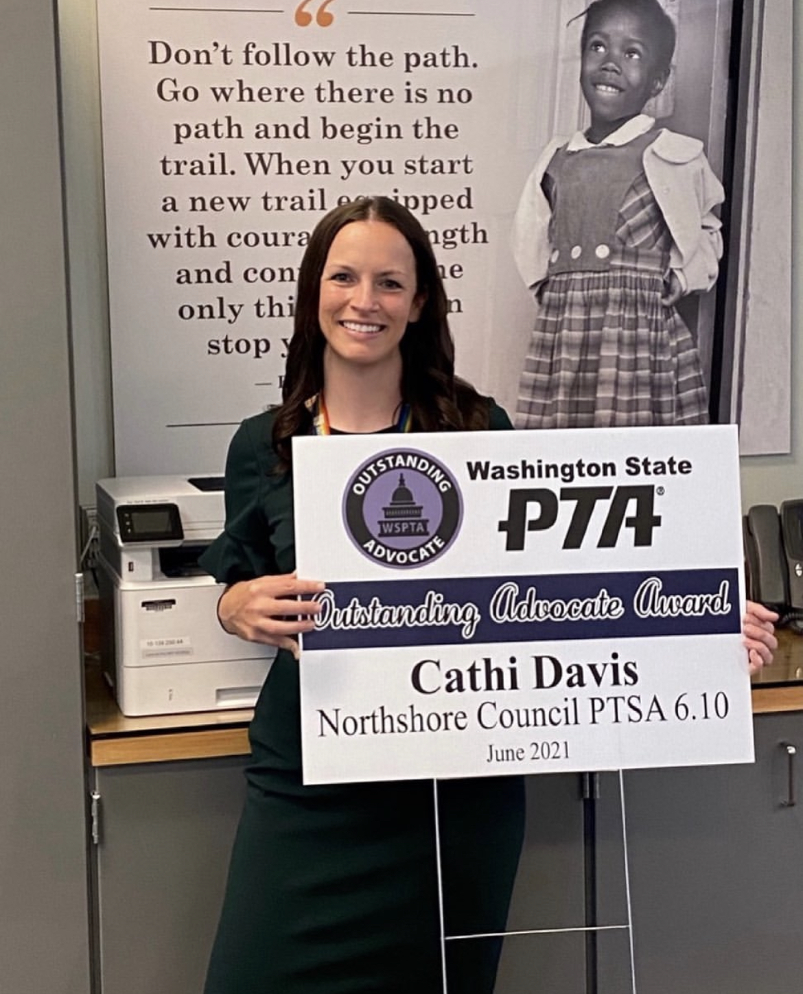 Cathi Davis holding a PTA award
