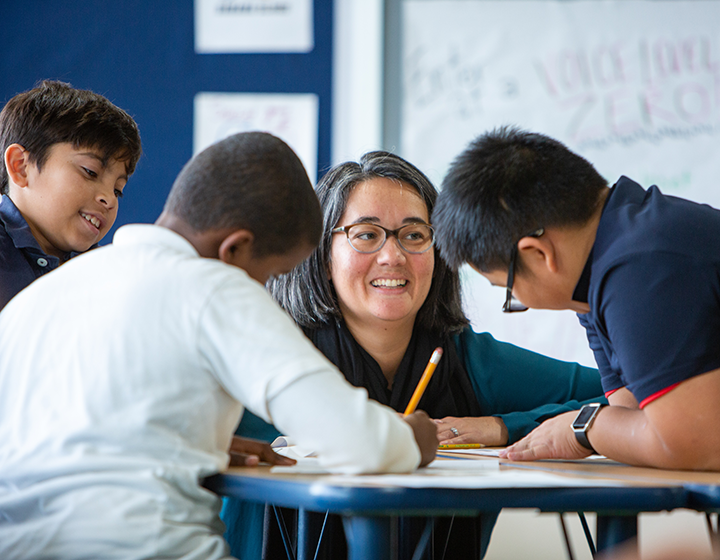 Dr. Megan Kelley-Petersen, director of the UW Accelerated Certification for Teachers (U-ACT) program, speaks with students at Rainier Prep in 2019.