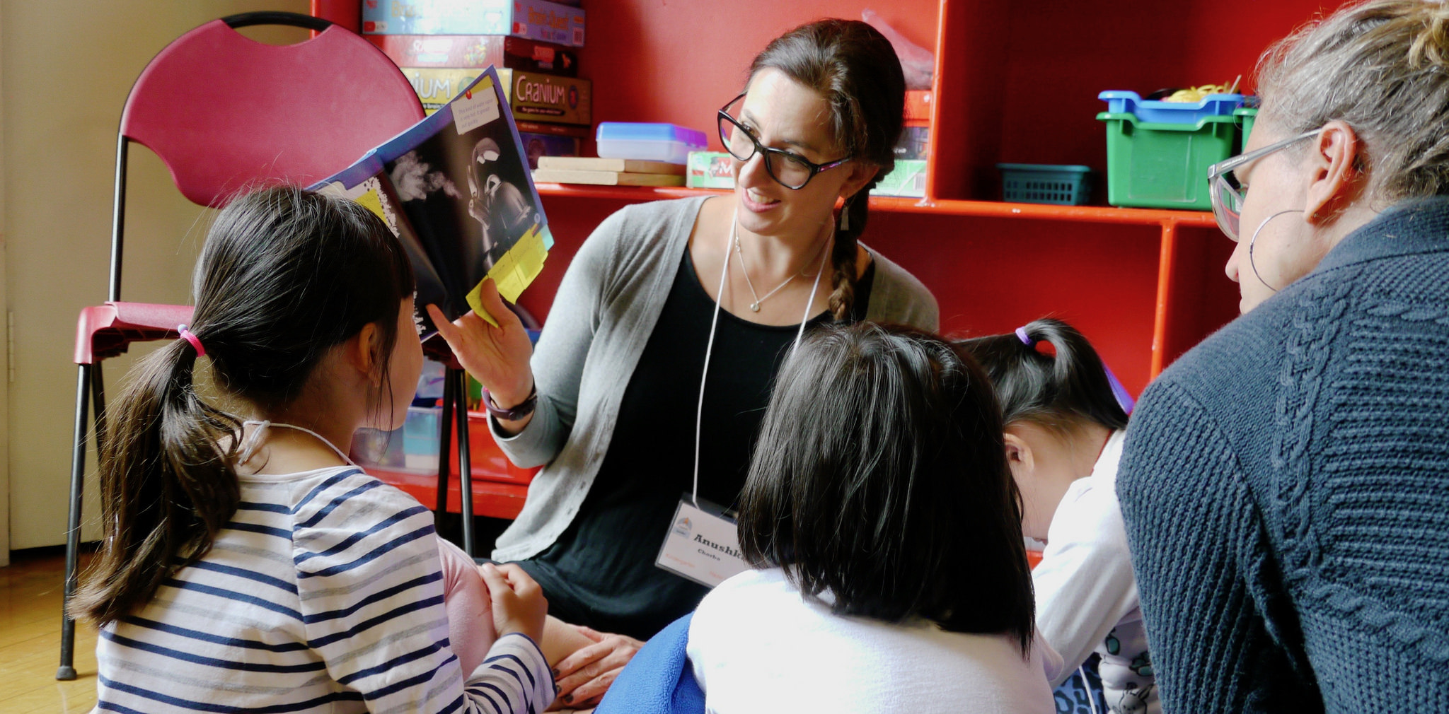 Elementary teacher with students teaching science