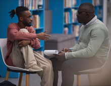 School counselor speaking with a student. Image source: Shutterstock