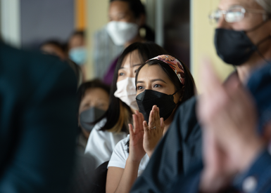 students attending a symposium