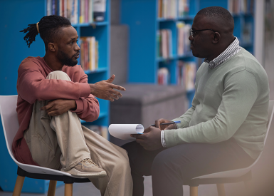 School counselor speaking with a student. Image source: Shutterstock