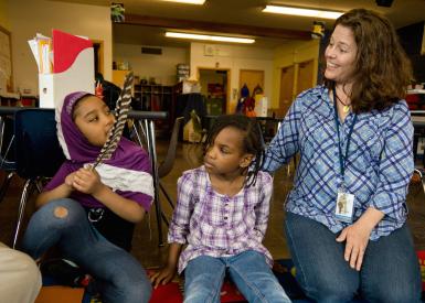 early start students speaking with a teacher